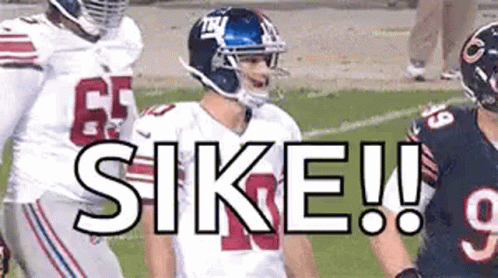 Football Players On Field One Wearing Helmet GIF