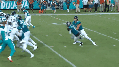 Football Players On Field With Number 135 GIF