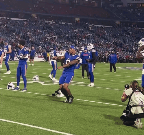 Football Players On Field With Number 8 Jersey GIF