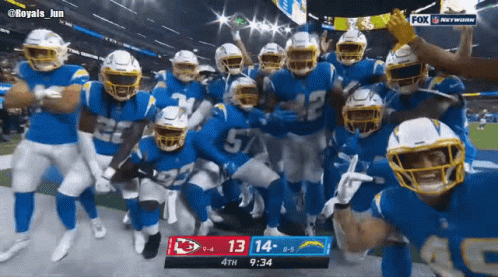 Football Players Posing With Scoreboard 13-14 GIF