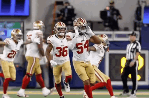 Football Players Running Number 54
