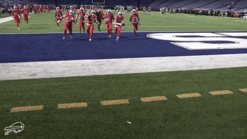 Football Players Running With Buffalo Logo