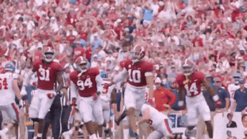 Football Players Running With Number 10 Jersey