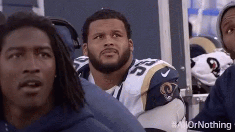 Football Players Sitting in Stadium