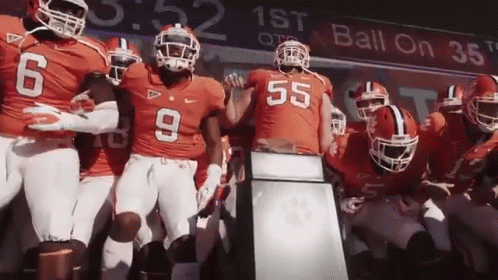 Football Players Standing in Front of Ball On 38 Sign