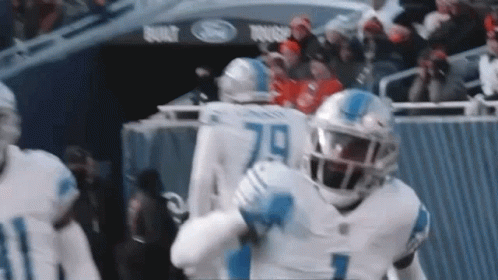 Football Players Standing On Field GIF