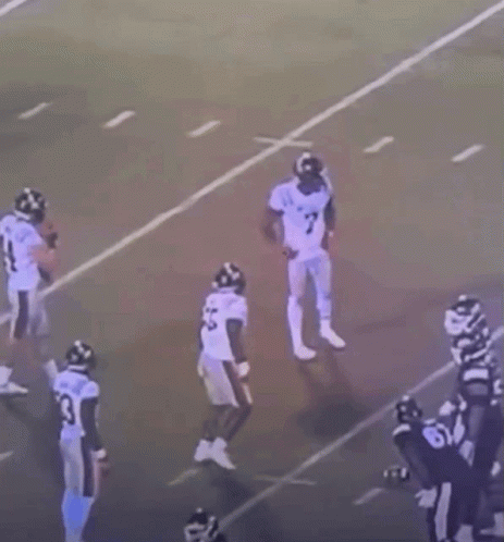 Football Players Standing On Field GIF
