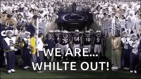 Football Players Standing On Field With Band GIF