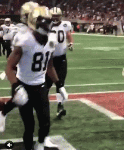Football Players Standing On Field GIF