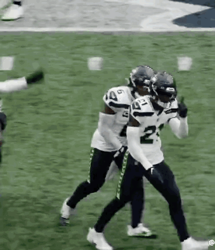 Football Players Standing On Football Field GIF
