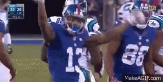 Football Players With Hands in the Air