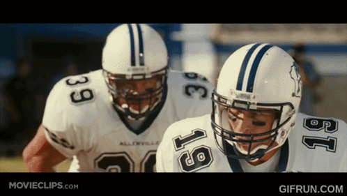 Football Players With Number 18 Helmets