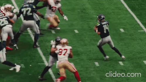 Football Thrown In Front Of To Lumen Banner GIF