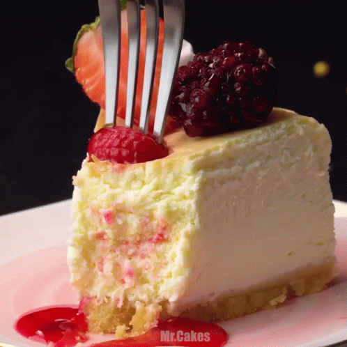 Fork Eating Cheesecake Slice with Raspberries