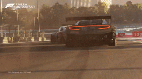 Forza Motorsport Two Cars Racing on Track