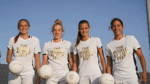 Four Female Soccer Players White Shirts The World At Our Feet