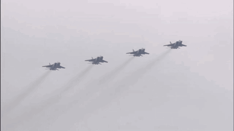 Four Fighter Jets Flying With Smoke Trails GIF