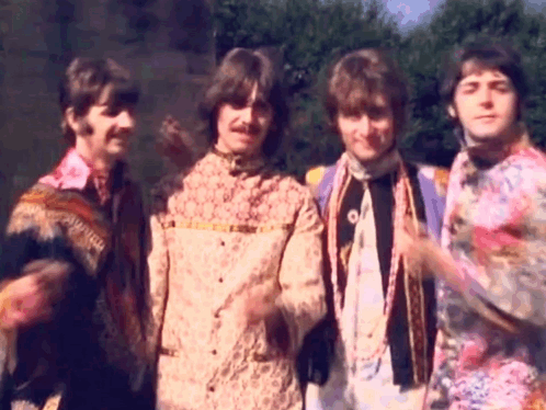 Four Men in Colorful Shirts Standing Together