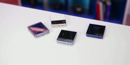 Four Phones On A Table One Of Which Has The Time Of 11:29 On It GIF