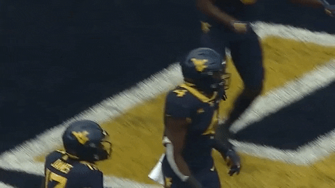 Four Players Of Mountaineers Doing Chest Bump GIF
