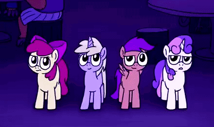 Four Ponies Standing Next to Each Other in a Dark Room