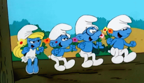 Four Smurfs Are Standing Next To Each Other With Flowers In Their Hands GIF
