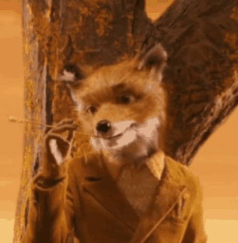 Fox in Suit Standing Next to Tree Smiling