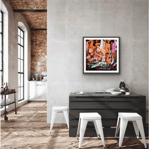 Framed Painting Hangs Above Table