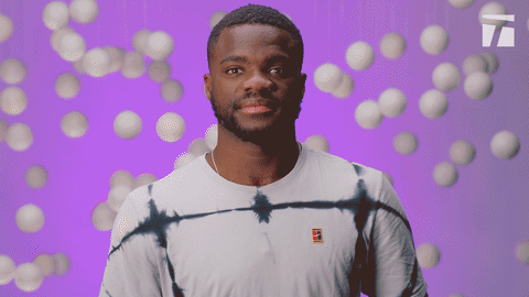 Francis Tiafoe Showing Off Muscles GIF
