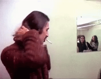 Frank Zappa Fixing Long Hair GIF