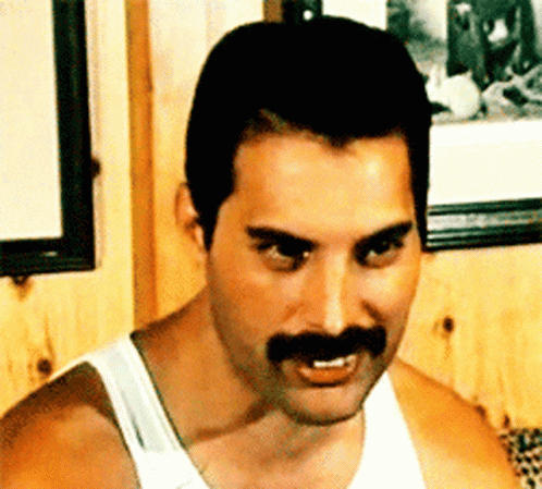Freddie Mercury Coy Laugh GIF