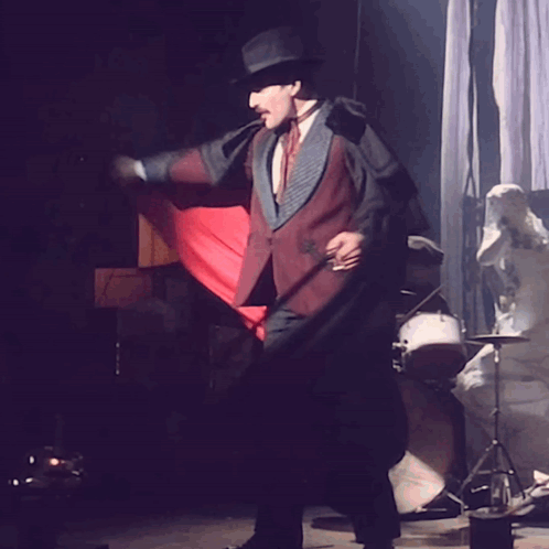 Freddie Mercury Red Cape Magician Attire GIF