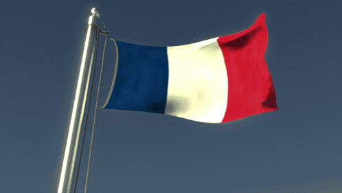 French Flag Flying in Wind Against Blue Sky