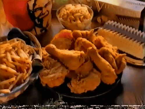 Fried Chicken And French Fries On A Table With A Kfc Cup GIF