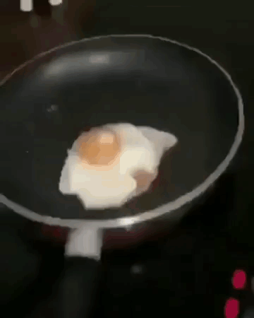 Fried Egg Cooking in Pan