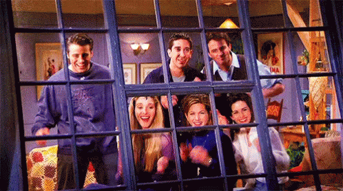 Friends Looking Out Window Smiling
