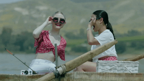 Friends Riding Skiff Surrounded Swimmers Doing Exercises GIF