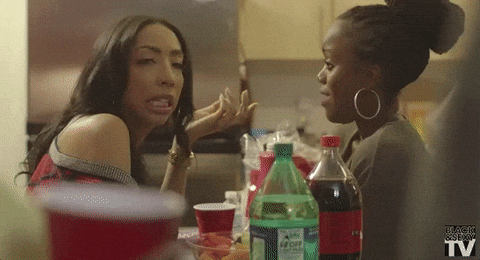 Friends Talking At African American Christmas Party GIF