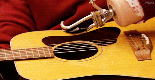 Frustrated Guitar Strumming GIF