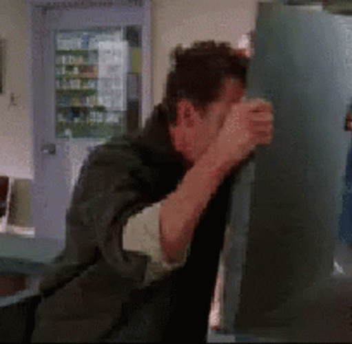Frustrated Guy Banging Head Against Wall  GIF
