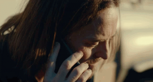 Frustrated Lucky Flynn Throwing Phone GIF
