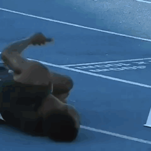 Frustrated Zambia Athlete Rolling On Ground GIF