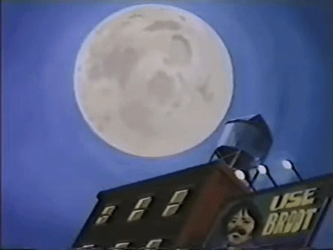 Full Moon Over Building With Water Tower GIF