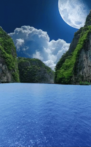 Full Moon Over Lake Surrounded By Mountains GIF