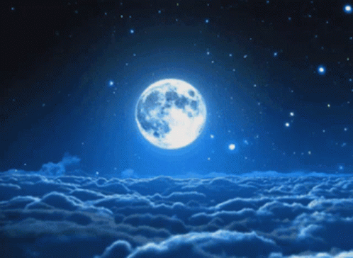 Full Moon Rising Over Cloudy Night