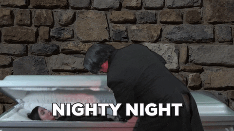 Lady Sleeping In Coffin At Funeral Home GIF
