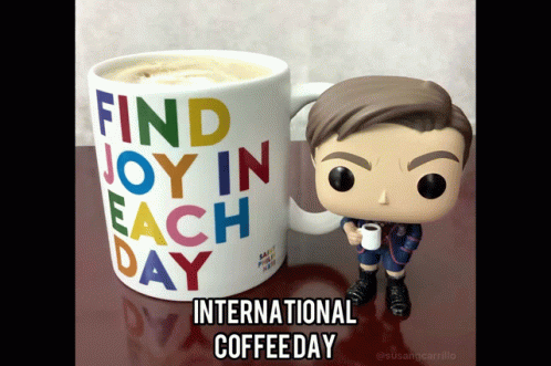 Funko Figure Holding Coffee Next to International Coffee Day Mug