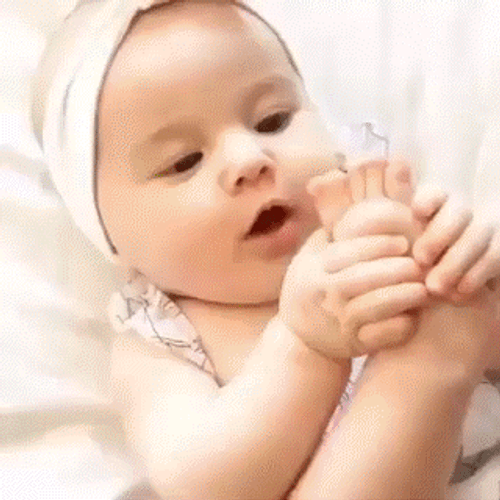 Funny Baby Tasting Own Foot GIF
