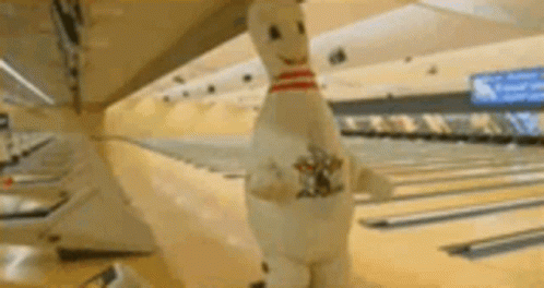 Funny Bowling Pin Mascot Chasing Players GIF