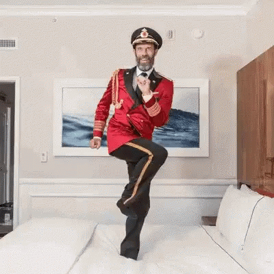 Funny Cruise Captain Dancing On Bed GIF